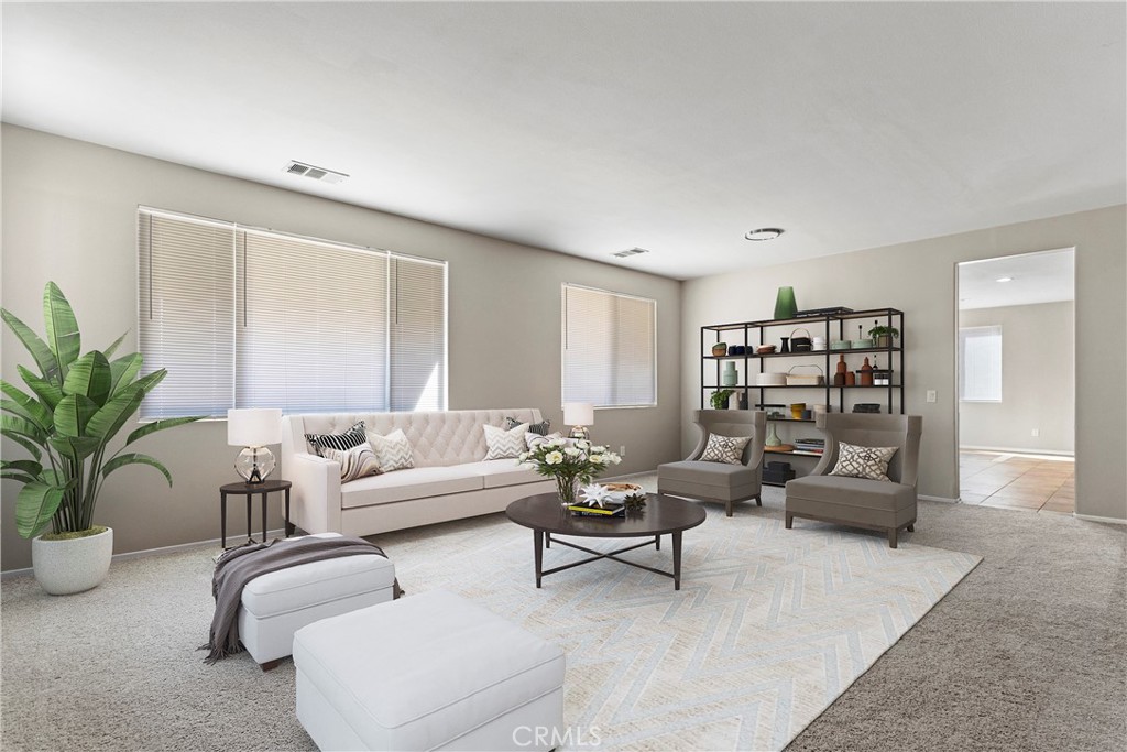 1128 East E Avenue Lancaster, CA 93535 - Photo 2 of 37 a living room with furniture and a potted plant