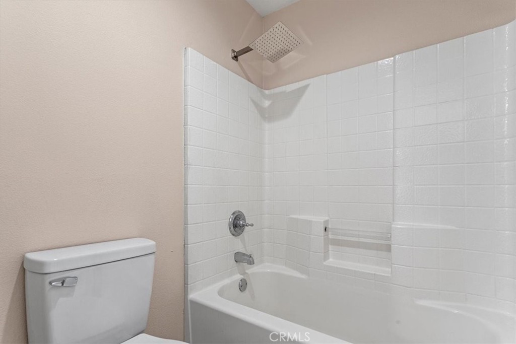 1128 East E Avenue Lancaster, CA 93535 - Photo 21 of 37 a bathroom with a bathtub and a toilet