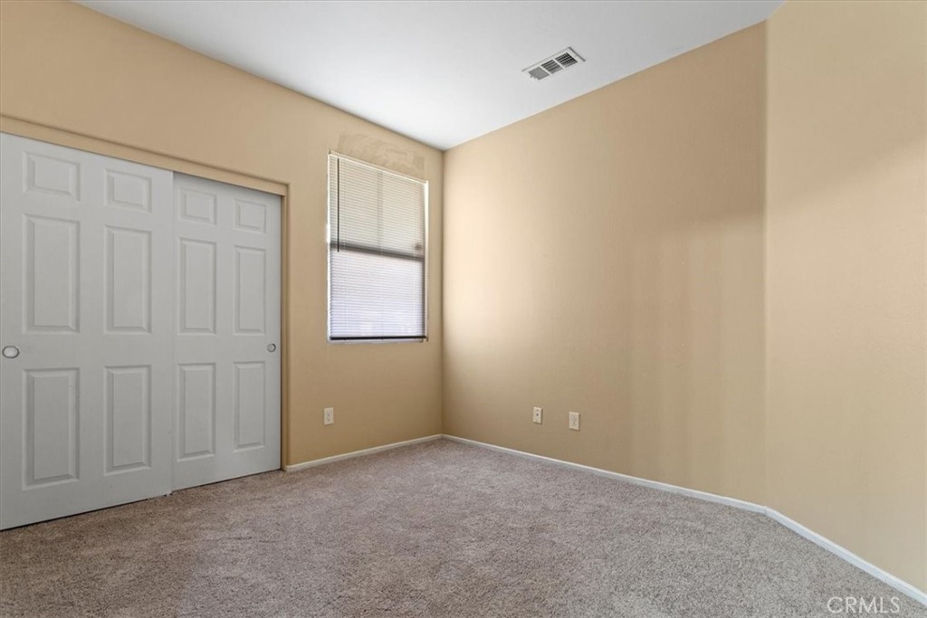 1128 East E Avenue Lancaster, CA 93535 - Photo 30 of 37 a view of an empty room with a window