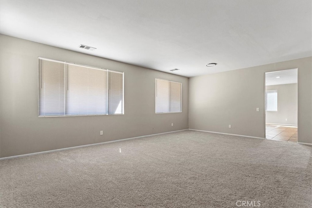 1128 East E Avenue Lancaster, CA 93535 - Photo 31 of 37 a view of an empty room with a window