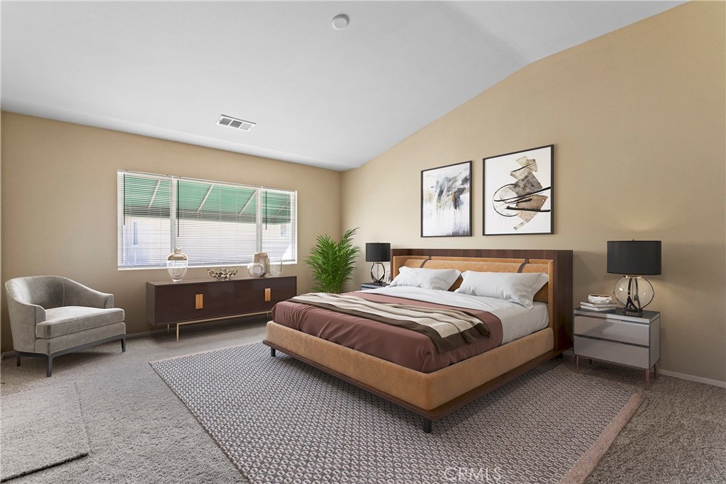 1128 East E Avenue Lancaster, CA 93535 - Photo 4 of 37 a spacious bedroom with a bed and glass window