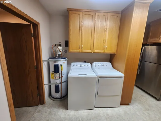 a view of a storage and utility room with a sink