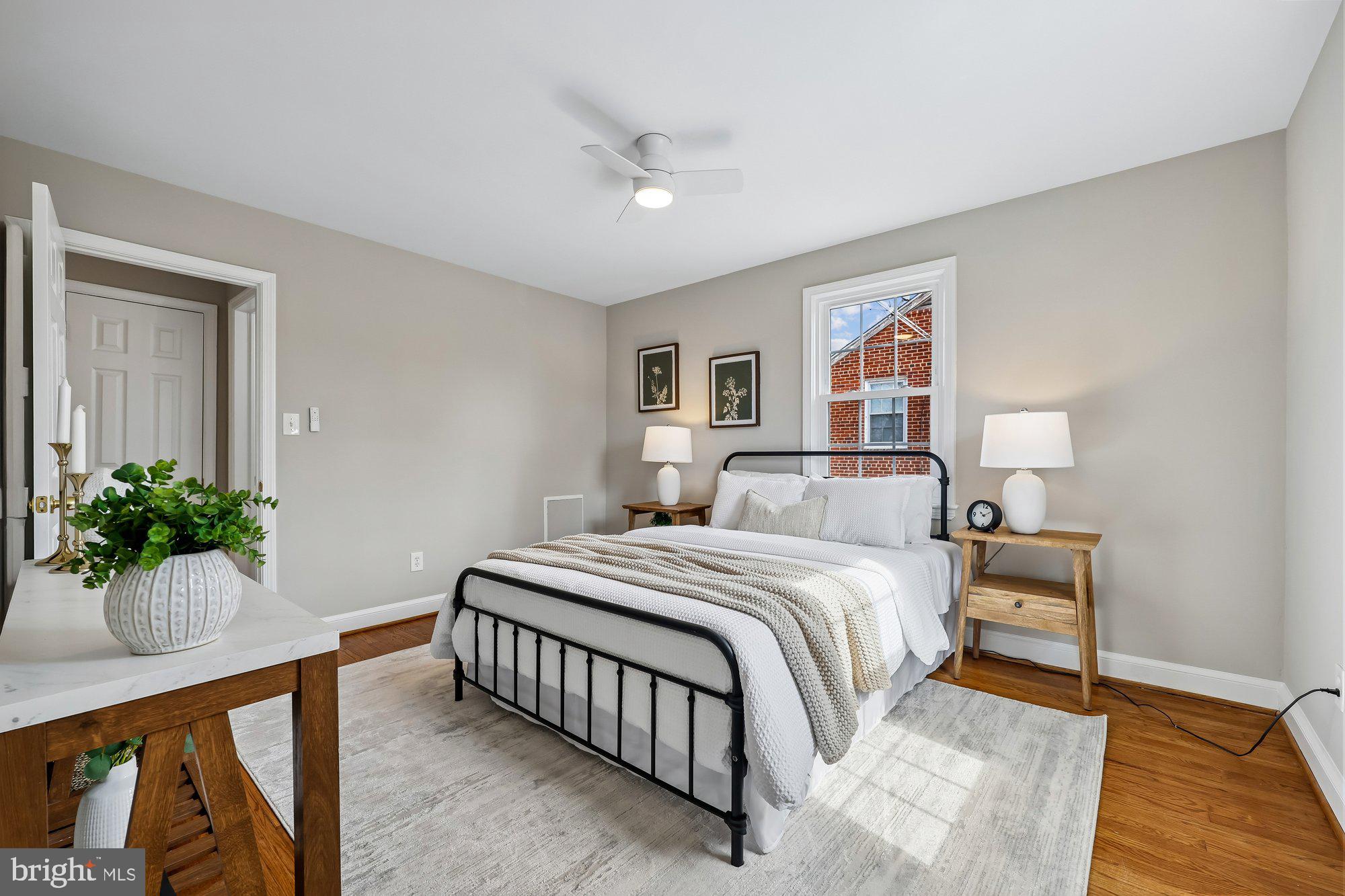 2613 Elnora Street Silver Spring, MD 20902 - Photo 22 of 54 a bedroom with a bed and a potted plant