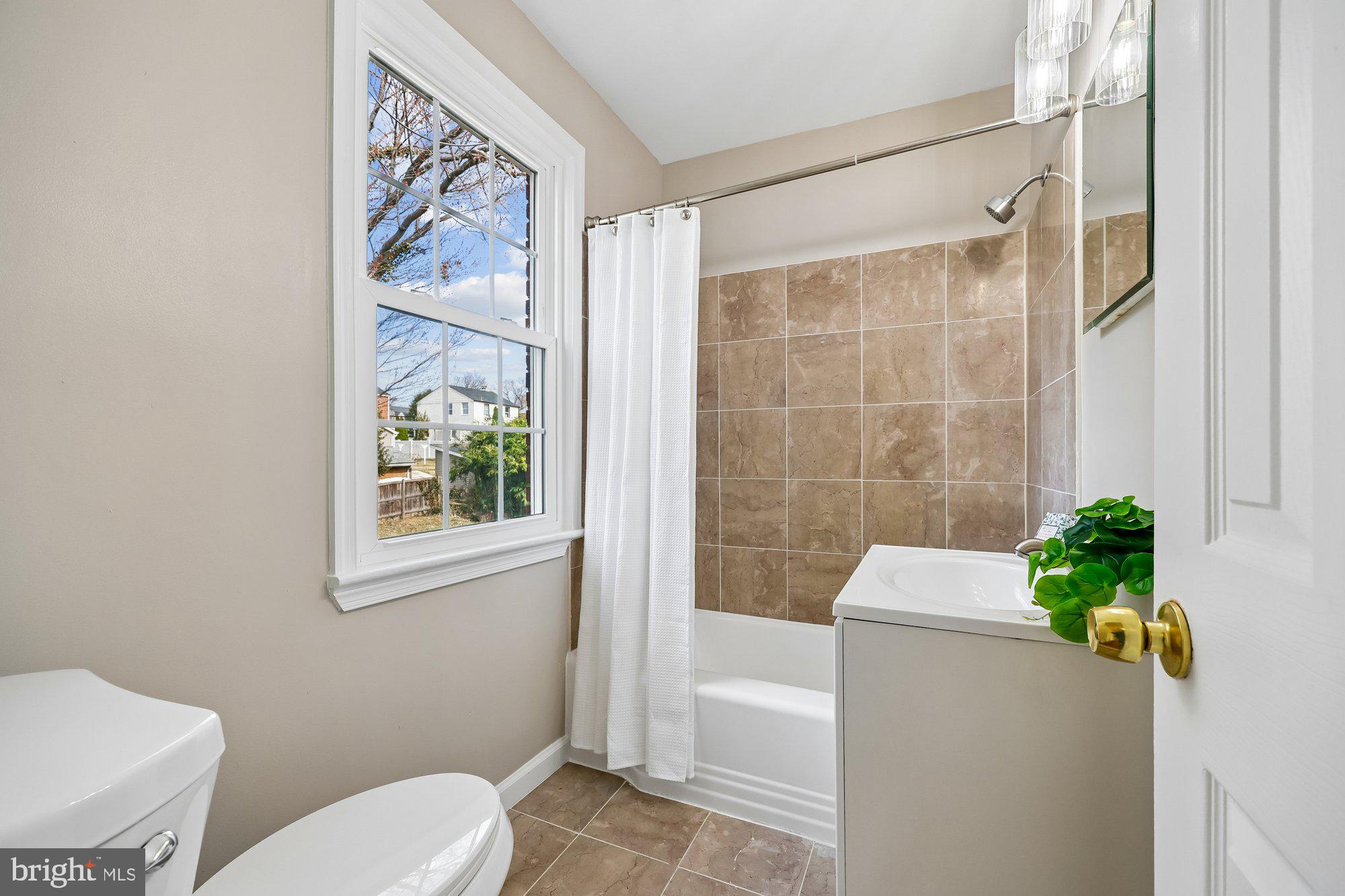 2613 Elnora Street Silver Spring, MD 20902 - Photo 23 of 54 a bathroom with a toilet and a shower