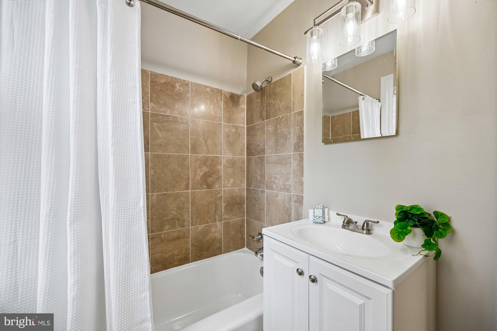 2613 Elnora Street Silver Spring, MD 20902 - Photo 24 of 54 a bathroom with a sink and a bathtub