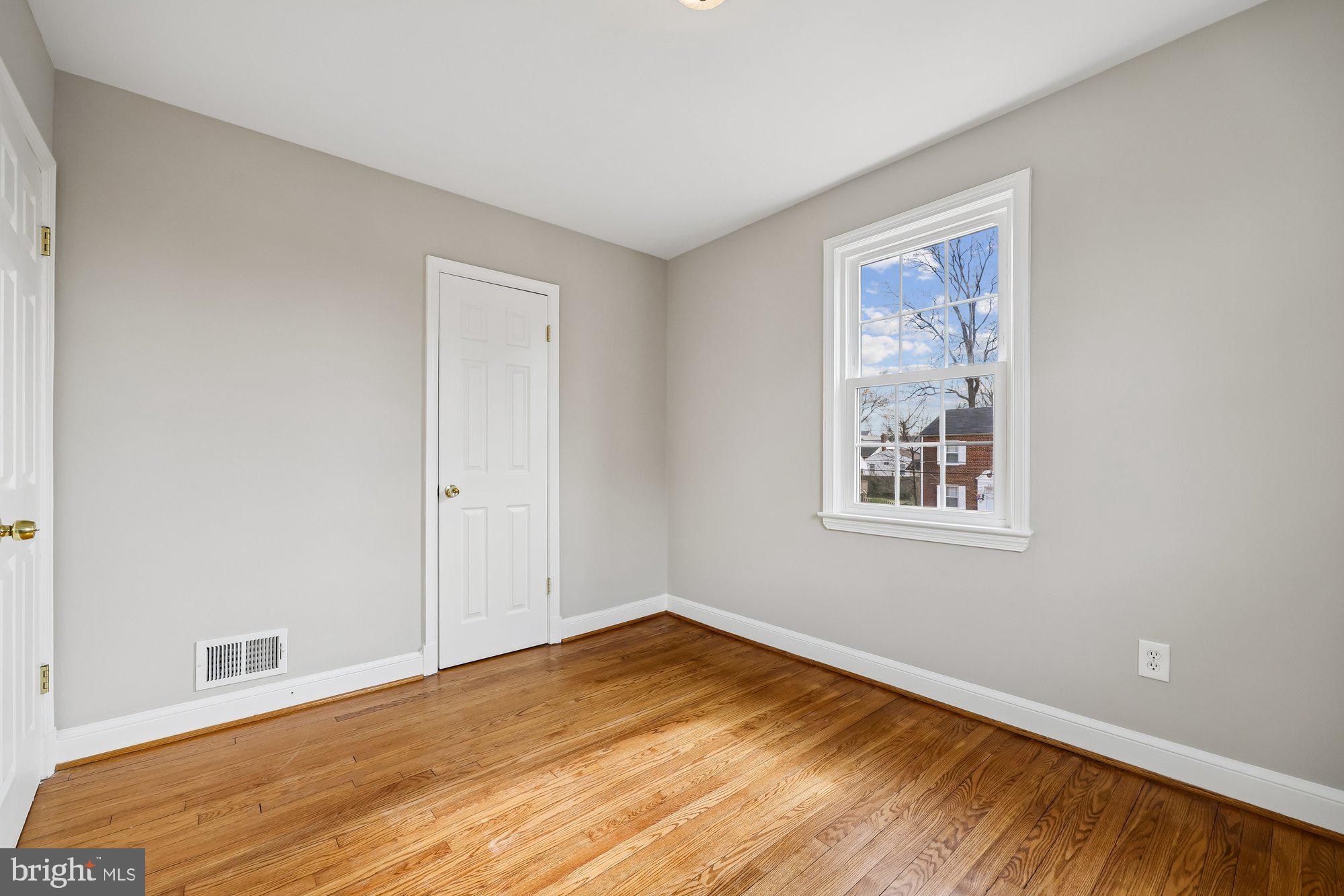 2613 Elnora Street Silver Spring, MD 20902 - Photo 27 of 54 a view of empty room with wooden floor
