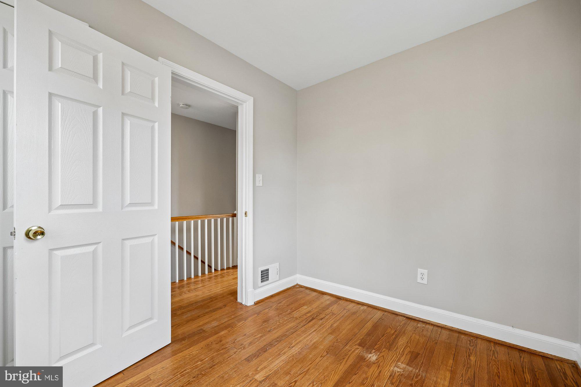 2613 Elnora Street Silver Spring, MD 20902 - Photo 28 of 54 a view of an empty room with wooden floor