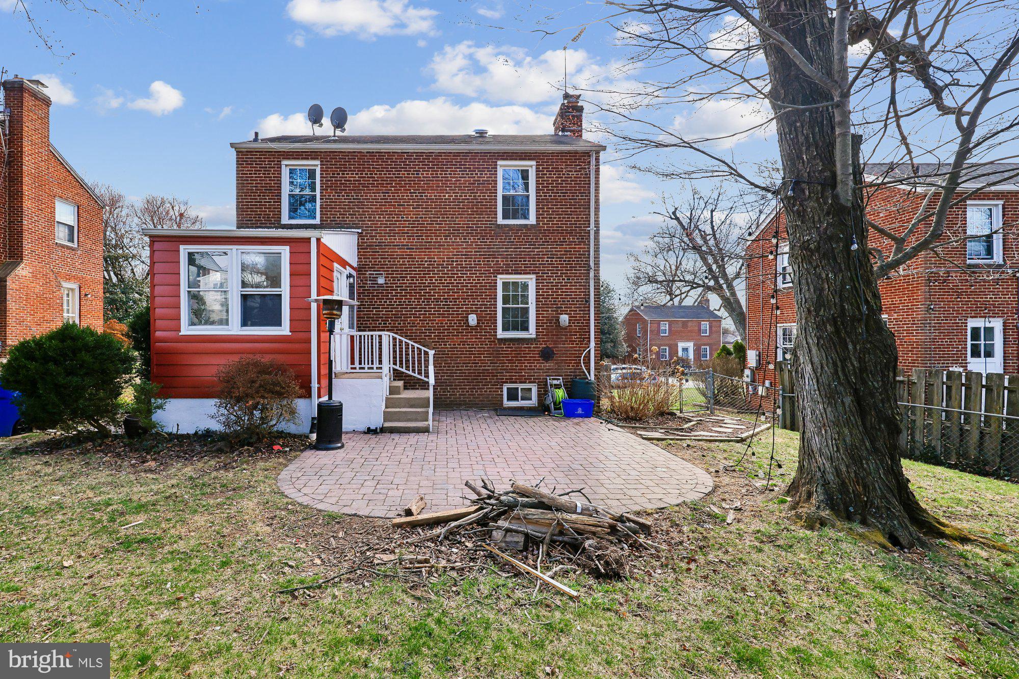 2613 Elnora Street Silver Spring, MD 20902 - Photo 39 of 54 a backyard of a house with yard and outdoor seating