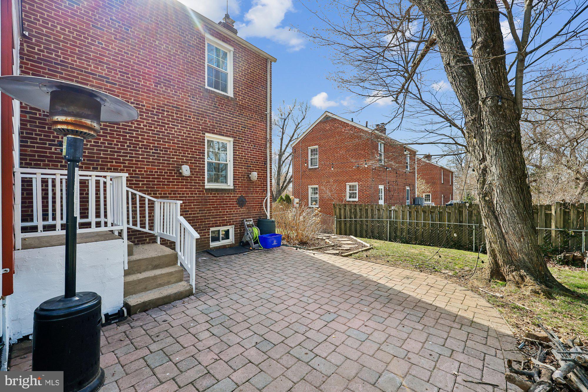 2613 Elnora Street Silver Spring, MD 20902 - Photo 43 of 54 a view of a brick house with a yard