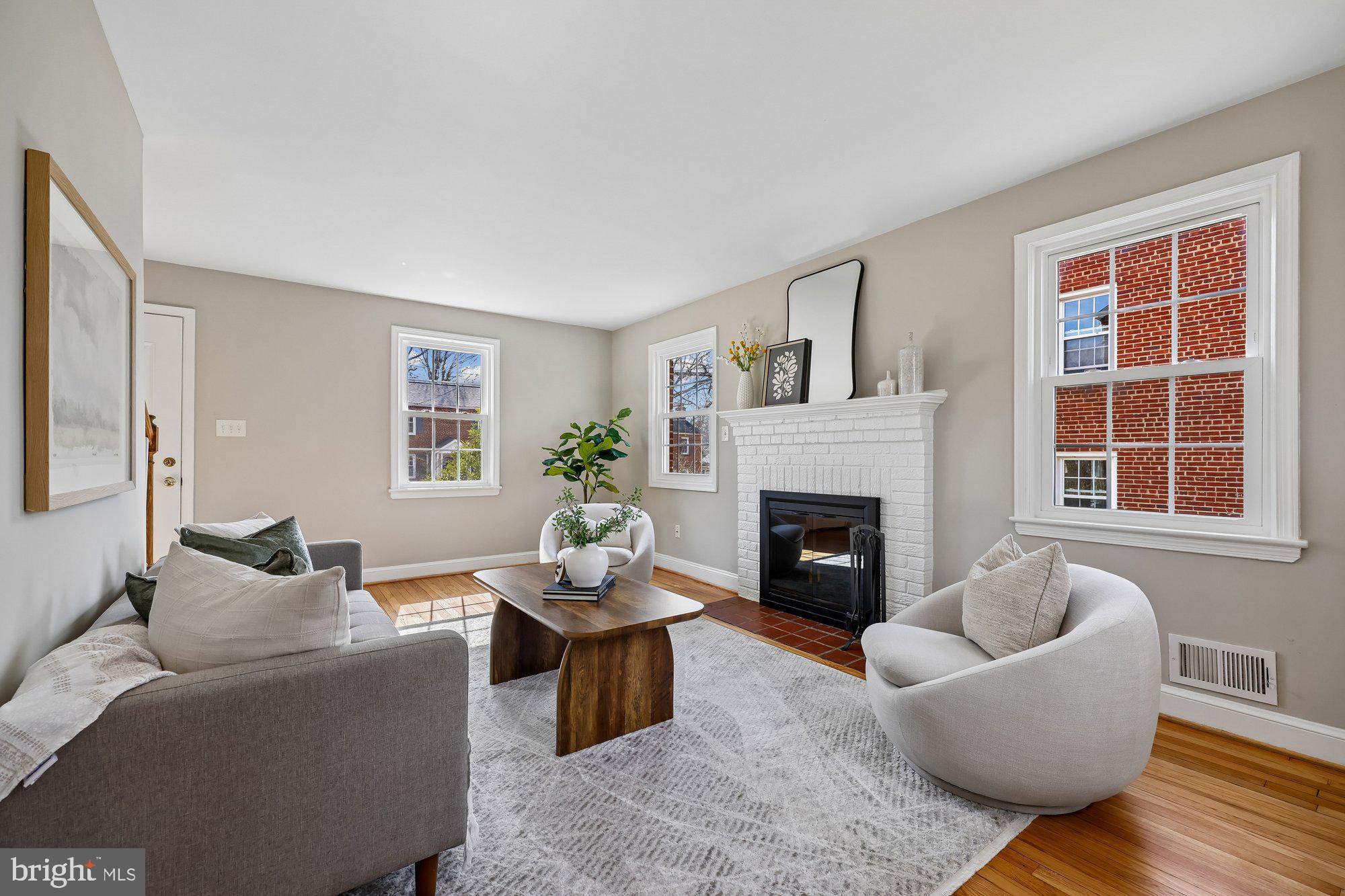 2613 Elnora Street Silver Spring, MD 20902 - Photo 7 of 54 a living room with furniture a window and a fireplace