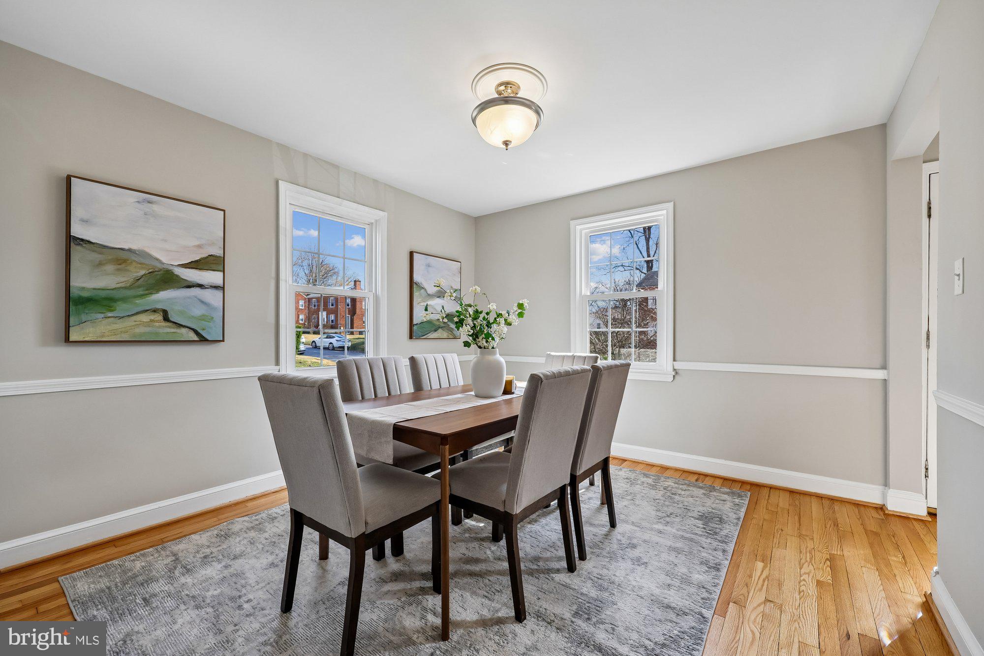 2613 Elnora Street Silver Spring, MD 20902 - Photo 10 of 54 a view of a dining room with furniture and wooden floor