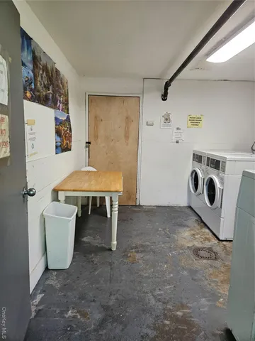 a view of a room with furniture and window