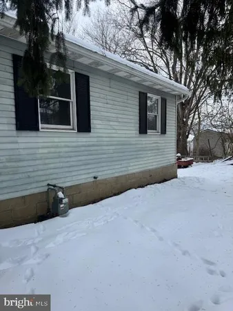 a backyard of a house with garage