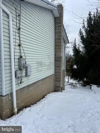 a view of a house with a snow