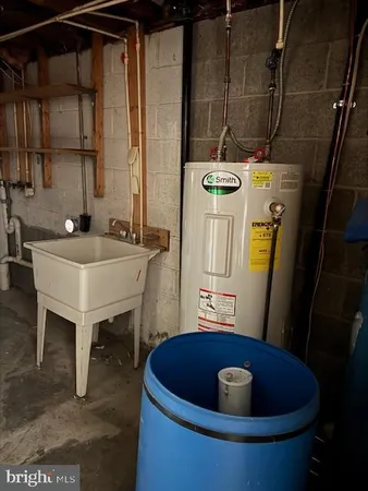 a blue and white sink sitting in a bathroom
