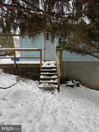 a backyard of a house with lots of green space and fountain