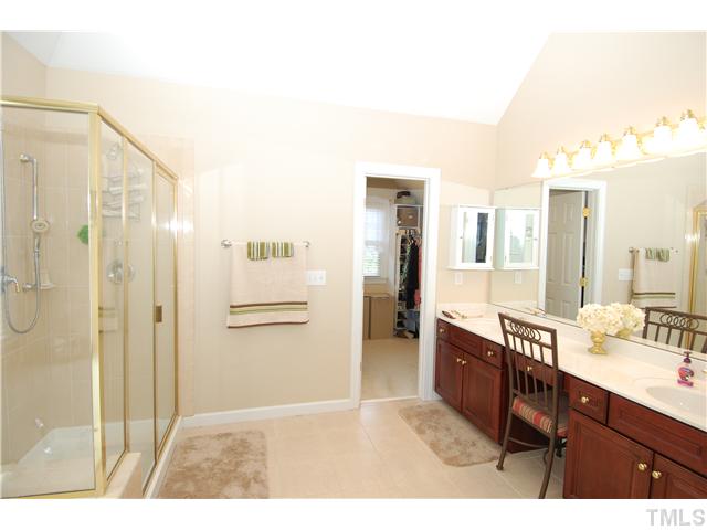 6101 Tiffield Way Wake Forest, NC 27587 - Photo 14 of 25 a bathroom with a sink and a mirror