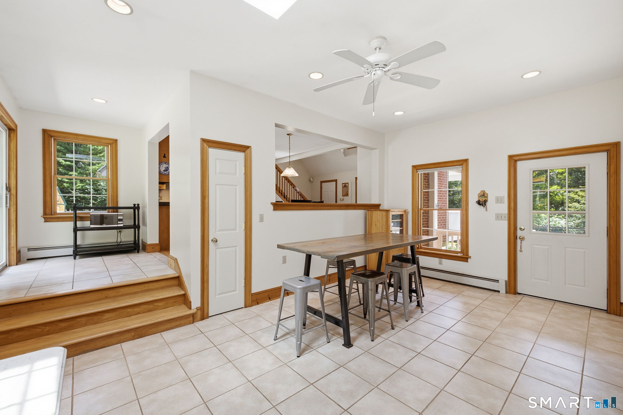 24 Liska Road Willington, CT 06279 - Photo 10 of 40 The sunroom is accessible from the covered breezeway entry.