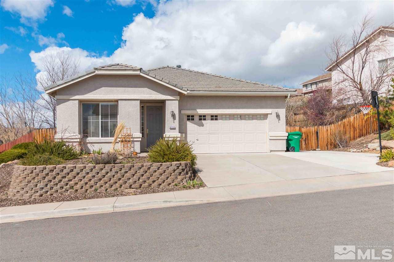 6725 Diamond Reno, NV 89523 - Photo 1 of 1 a front view of a house with a yard and garage