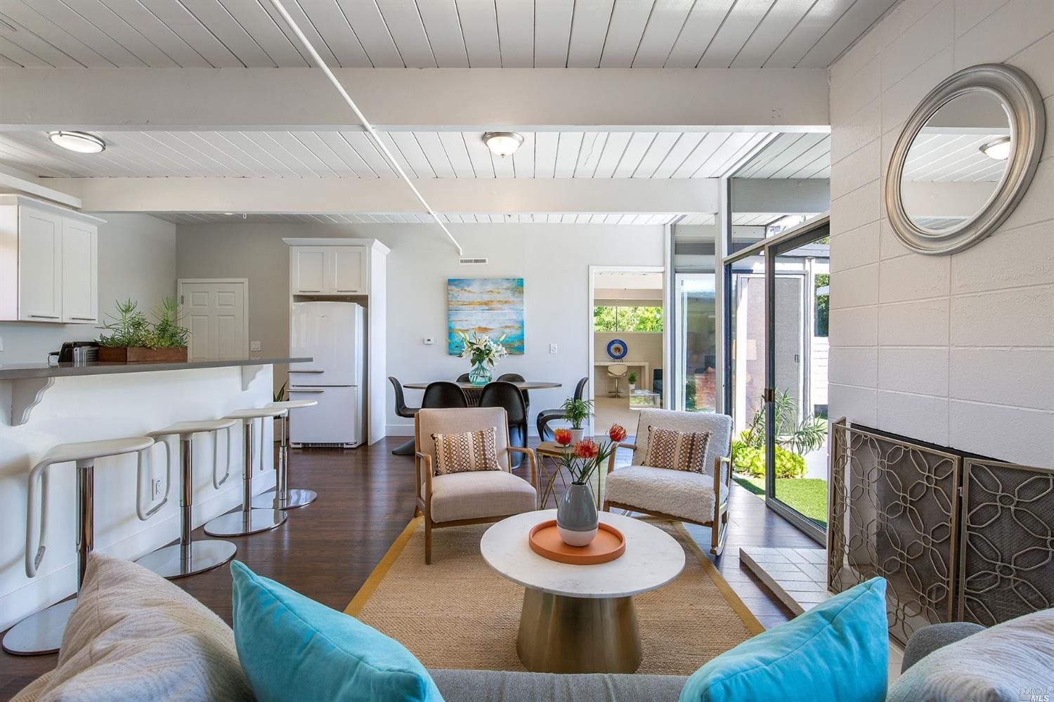 1061 Las Raposas Road San Rafael, CA 94903 - Photo 1 of 1 a living room with furniture and a wooden floor