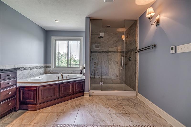 306 Buckingham Drive Venetia, PA 15367 - Photo 12 of 25 Enjoy sitting in this large soaking bathtub and choose between the rain head or regular shower head.