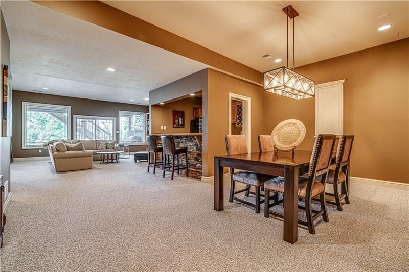 306 Buckingham Drive Venetia, PA 15367 - Photo 18 of 25 Full finished walkout basement. Instead of a table and chairs, a pool table will fit well at this spot.