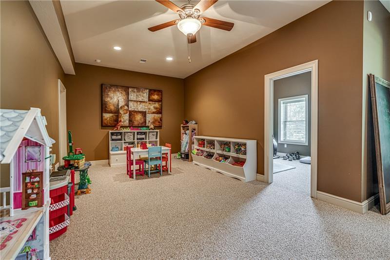 306 Buckingham Drive Venetia, PA 15367 - Photo 22 of 25 Great area for playing or can be converted to a movie room. To the right is entrance into fifth bedroom.