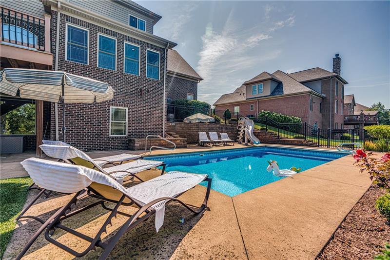 306 Buckingham Drive Venetia, PA 15367 - Photo 23 of 25 Dive right into this delightful and inviting swimming pool. Great fun with the slide.