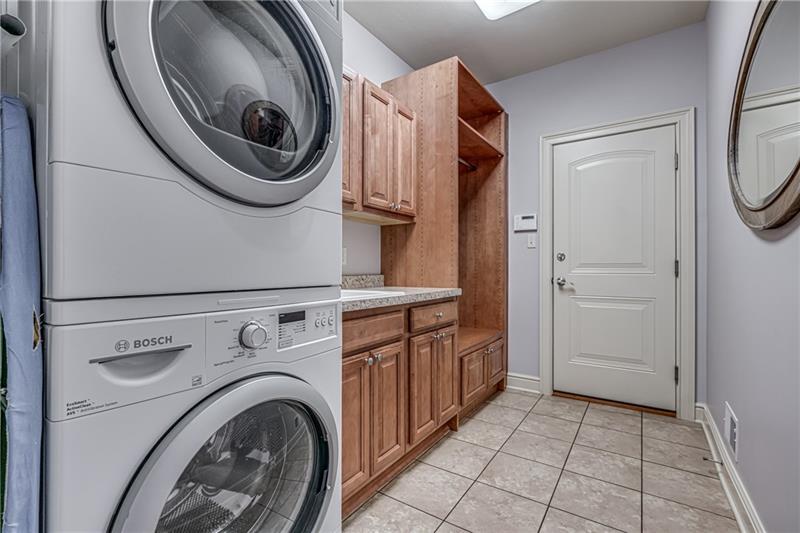 306 Buckingham Drive Venetia, PA 15367 - Photo 9 of 25 First floor laundry room beside the kitchen. The door leads to a 3 car attached garage which makes carrying in groceries a breeze.