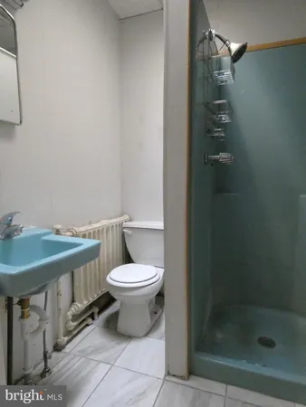 a bathroom with a toilet and a sink