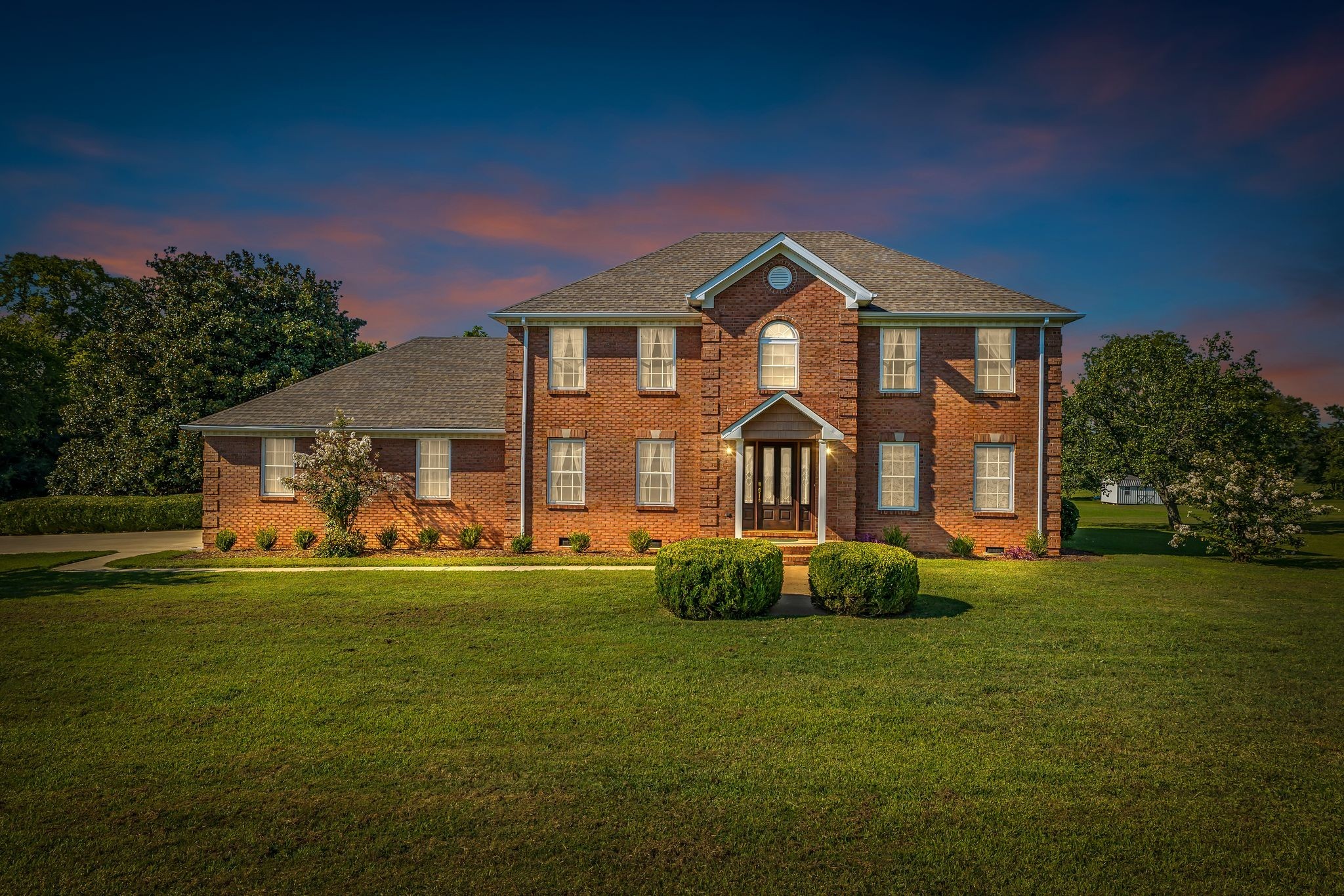 a front view of a house with a yard