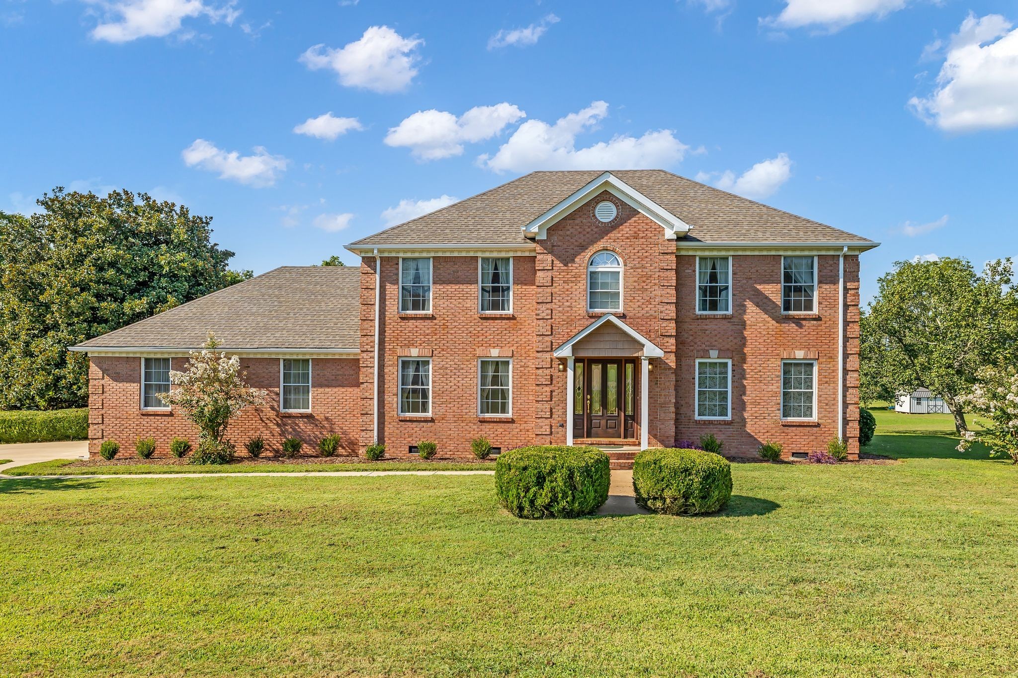 207 Sugar Tree Lane Pulaski, TN 38478 - Photo 2 of 30 a front view of a house with garden