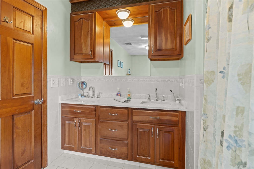 36 High Street Freetown, MA 02702 - Photo 29 of 42 a bathroom with a sink a vanity and a mirror