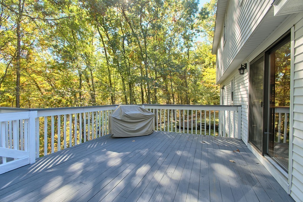 25 Autumn Road Lunenburg, MA 01462 - Photo 22 of 26 a balcony with wooden floor and fence