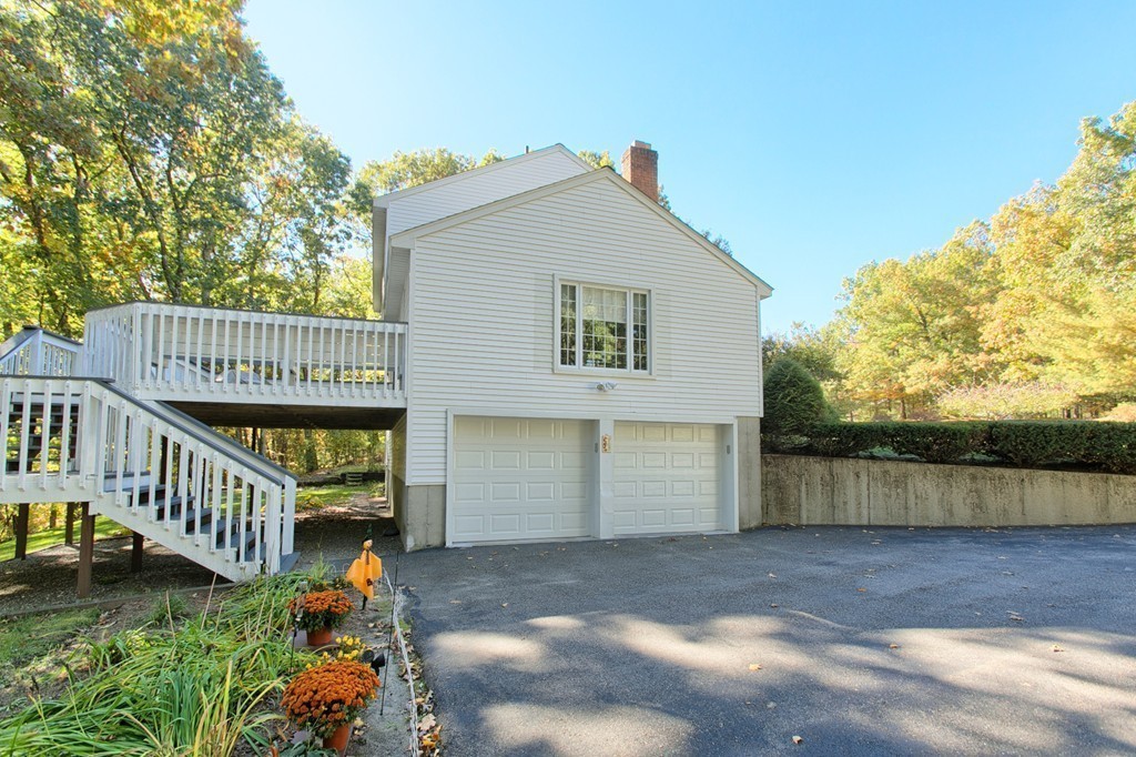 25 Autumn Road Lunenburg, MA 01462 - Photo 24 of 26 a view of a house with a yard and sitting area