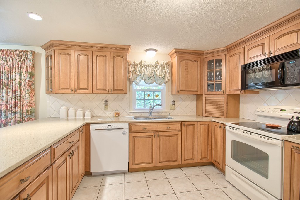 25 Autumn Road Lunenburg, MA 01462 - Photo 3 of 26 a kitchen with a sink stove top oven and cabinets