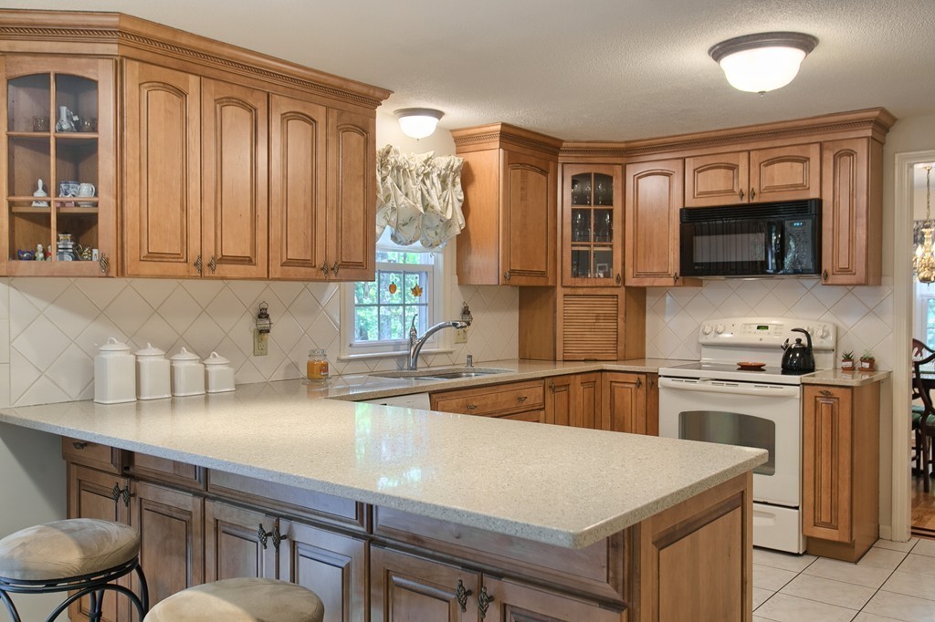 25 Autumn Road Lunenburg, MA 01462 - Photo 4 of 26 a kitchen that has a sink a stove and chairs