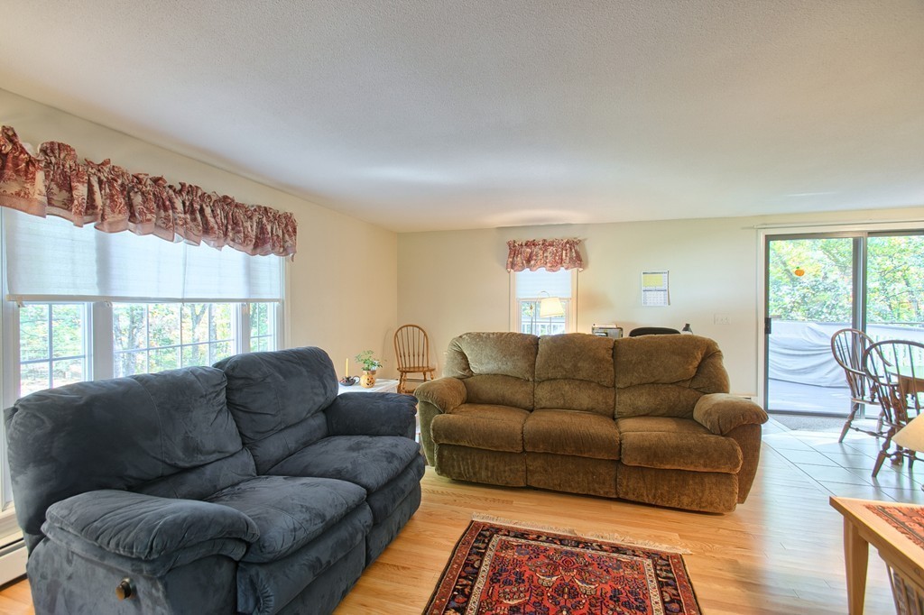 25 Autumn Road Lunenburg, MA 01462 - Photo 10 of 26 a living room with furniture and a large window