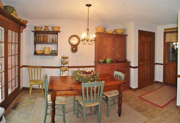 131 Aubinwood Road Amherst, MA 01002 - Photo 11 of 30 a view of a dining room with furniture and a chandelier