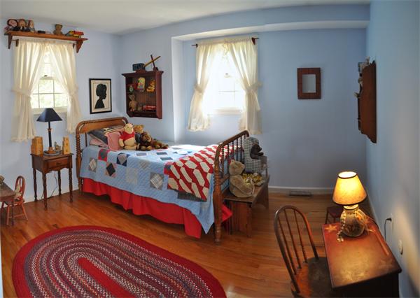 131 Aubinwood Road Amherst, MA 01002 - Photo 20 of 30 a bedroom with a bed and wooden floor