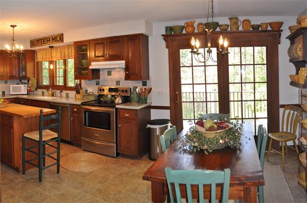 131 Aubinwood Road Amherst, MA 01002 - Photo 9 of 30 a kitchen with stainless steel appliances a stove a sink dishwasher and cabinets