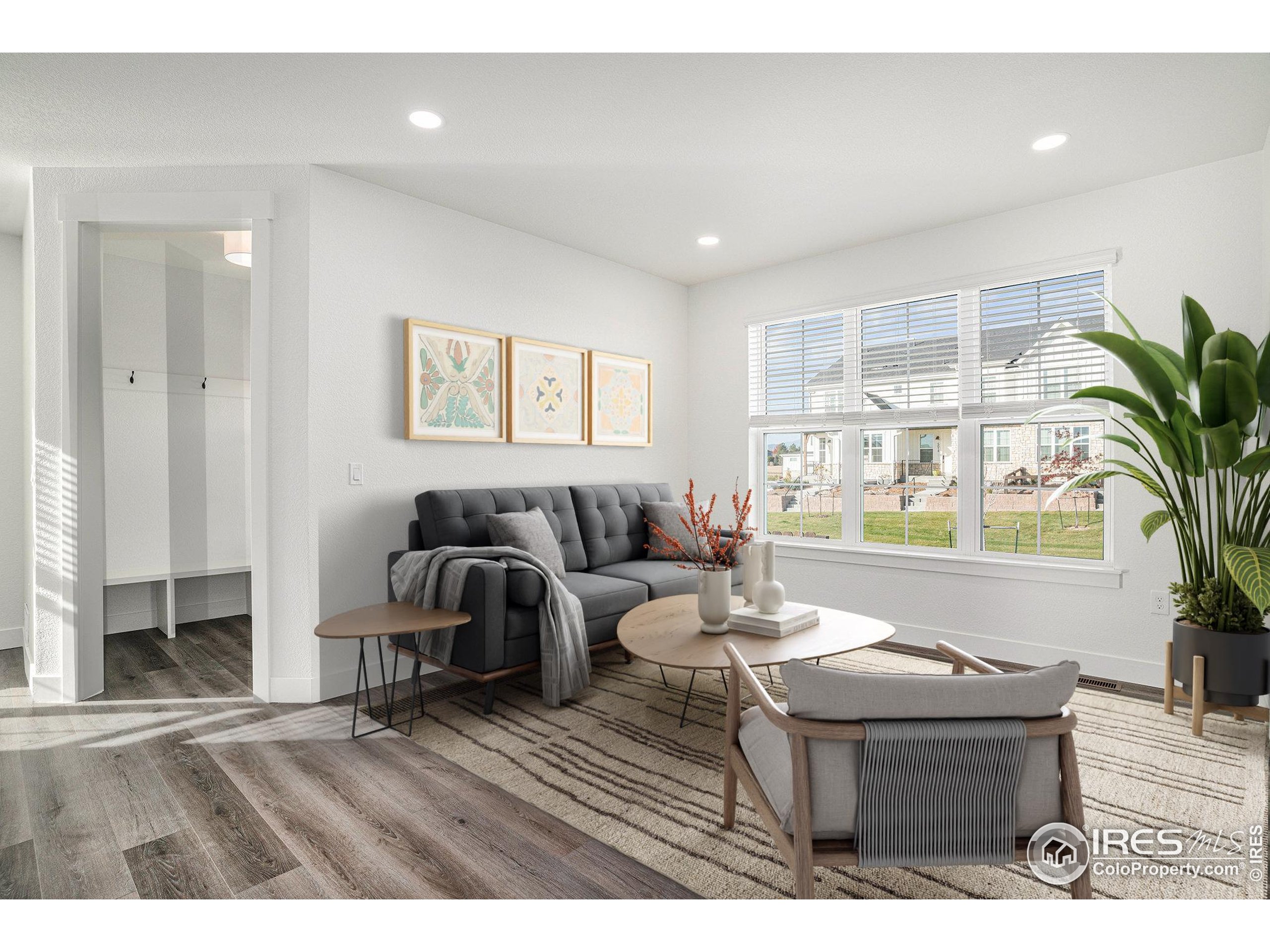 5049 Avon Avenue Loveland, CO 80538 - Photo 2 of 10 a living room with furniture and a large window
