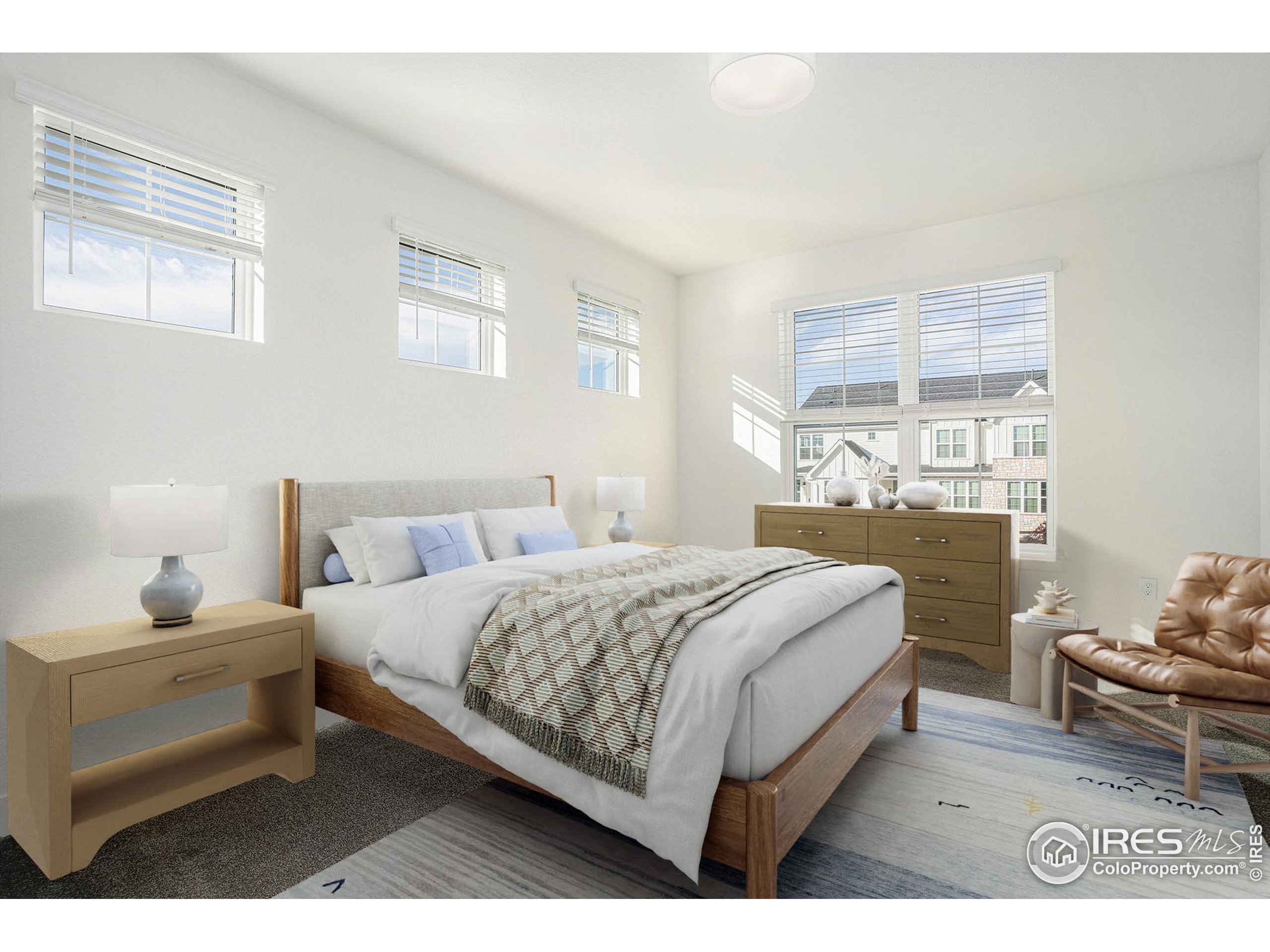 5049 Avon Avenue Loveland, CO 80538 - Photo 6 of 10 a bedroom with a bed and window