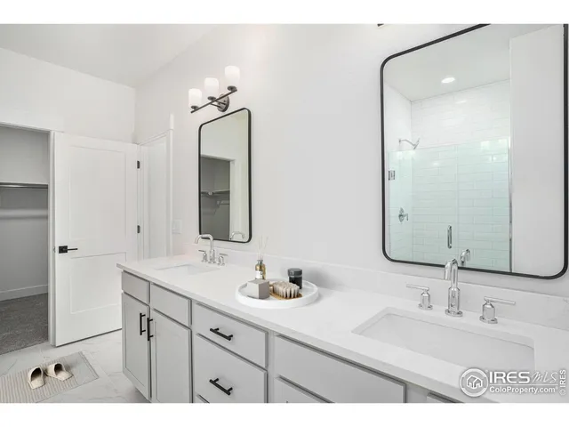 a bathroom with a sink vanity and a mirror