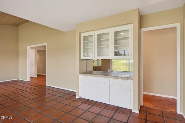 a view of an empty room with glass door