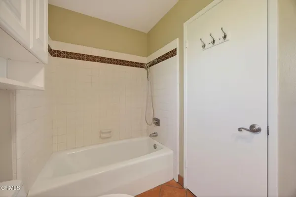 a view of a backyard with table and chairs and a slide