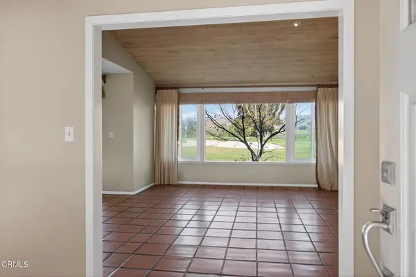 a view of an empty room and window