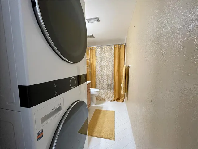 a view of a bathroom with a glass door shower