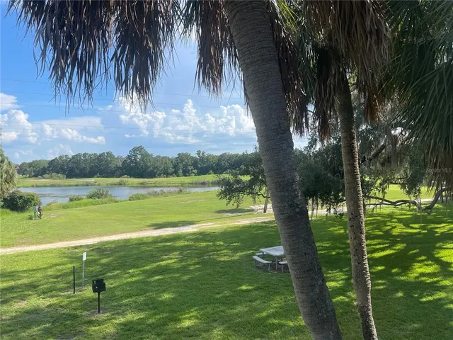 a view of a golf course with a lake view