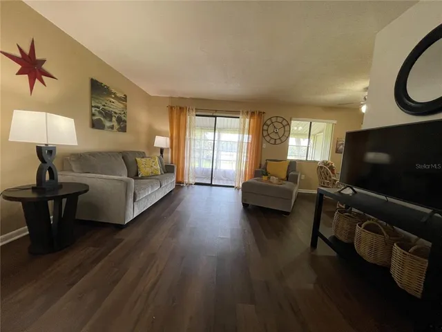 a living room with furniture and a window